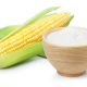 Corn flour in wooden bowl and fresh sweet corn isolated on white background.
